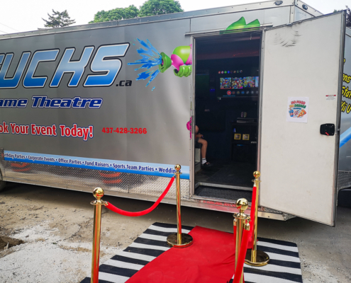 Red carpet entrance to GameTrucks GT gaming trailer