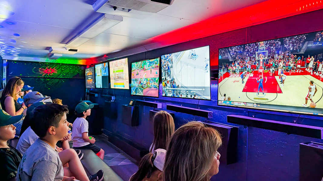 Kids playing video games inside a gaming truck in Toronto
