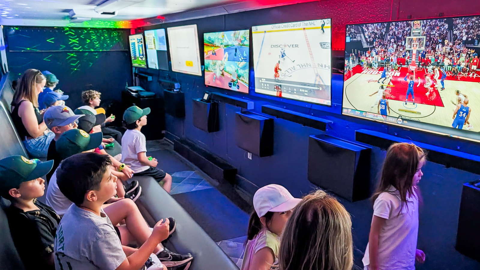 Group of kids playing video games inside a Game Truck