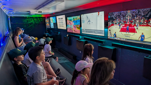 Kids playing together inside a mobile video game truck Kids playing together inside a mobile video game truck