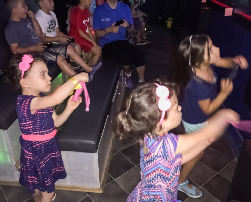 Kids having fun together at a mobile gaming party